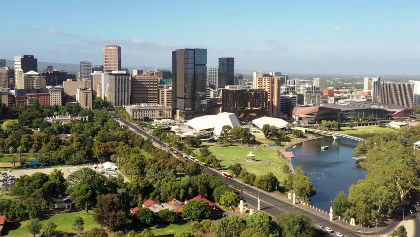 Torrens river shores in Adelaide city of South Australia – aerial skyline cityscape.
