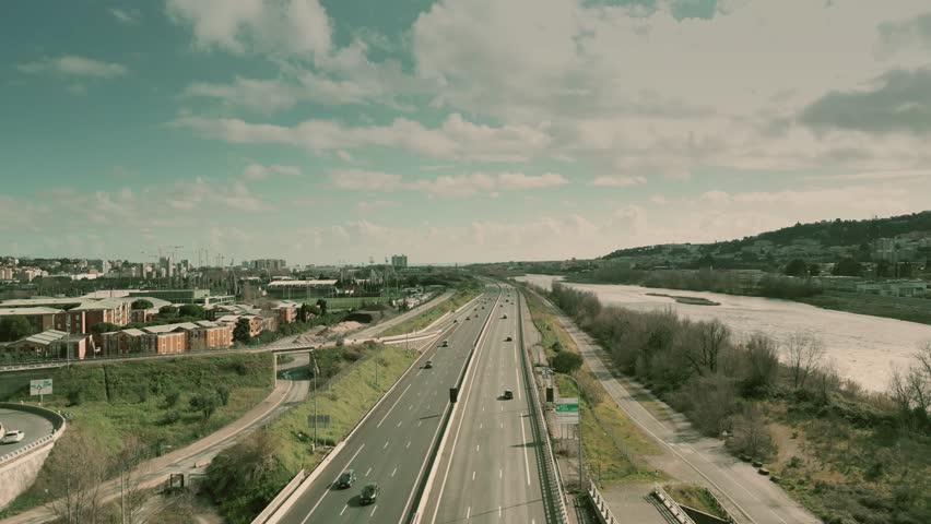 Aerial view of highway and bike path leading to the city of Nice along the Var River, France