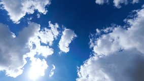 Blue Sky with White Clouds. Puffy Fluffy White Clouds Moving Fast. Cumulus Cloudscape Timelapse. Summer Nature Weather Sky Time Lapse Video