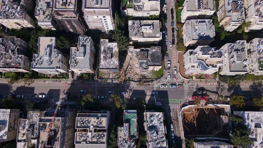 Top View Of Building Demolition Site Along Road In Tel Aviv-Jaffa, Israel. aerial shot