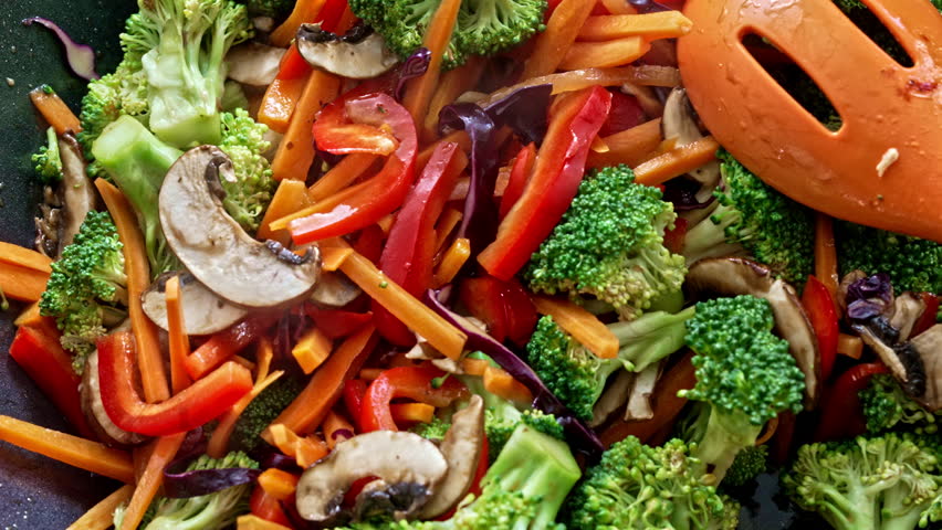 Burst Of Colors And Tastes - Stir-Fried Veggies Linger In The Wok During Final Moments Of Cooking, Unveiling Amazing Scents With The Rising Steam