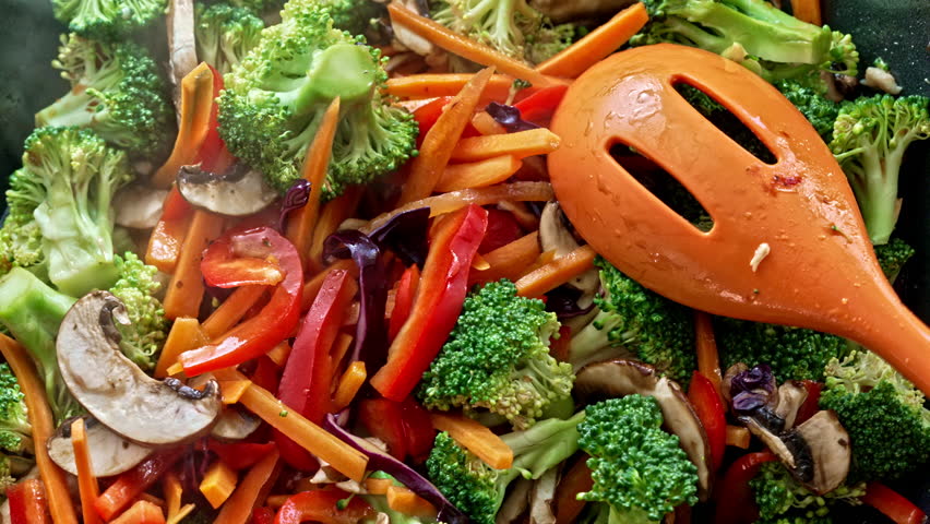 An Explosion Of Colors And Flavors - Sautéed Vegetables Rest In The Pan In The Last Seconds Of Preparation Revealing Incredible Aromas Through The Steam