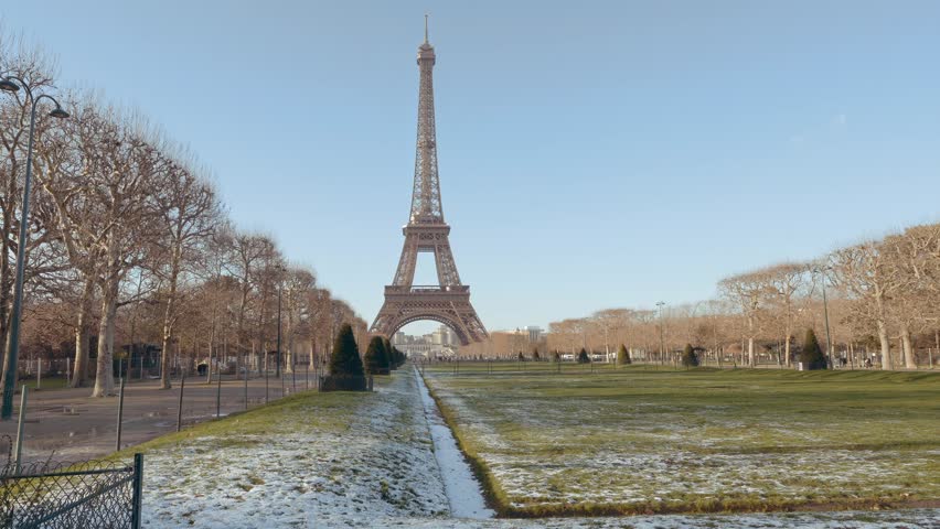 Eiffel Tower Wide Shot Front on Side ,Snow On Champ De Mars ,Dog Passing By (available in 4k60p) Royalty-Free Stock Footage #3477302857