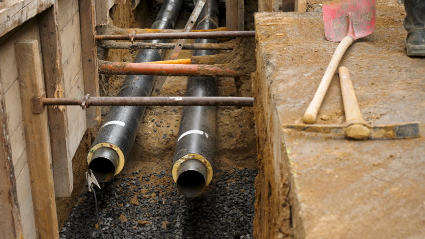 Construction site and pipe laying in the city center - high-angle view