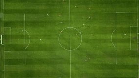 Aerial view of a soccer field in action, with players running, passing, and scoring goals. - Powered by Shutterstock - Get 15% off with code: PIKWIZARD15