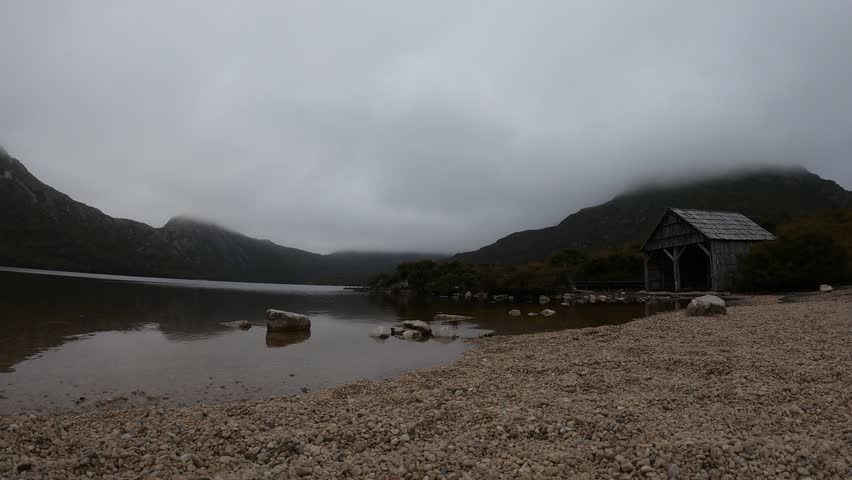 Timelapse of low clouds moving fast over Dove Lake near Cradle Mountain in Tasmania, Australia. Copy space
