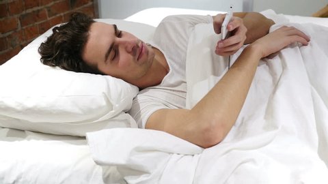 Man Lying in Bed Talking on Mobile Phone, Negotiation