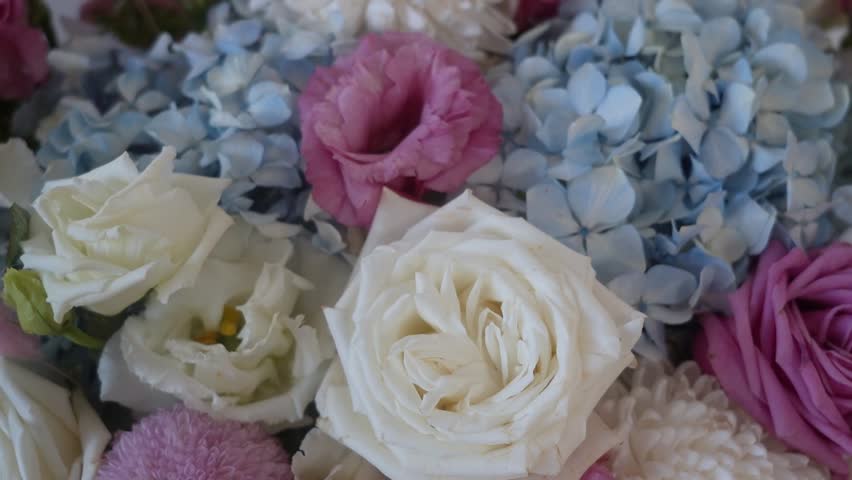 A combined bouquet of different types of flowers in close-up, beautiful dried flowers in a gift bouquet. Beautiful bouquet of flowers in pastel shades.  Royalty-Free Stock Footage #3477400003