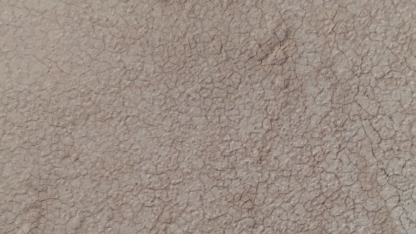 Drone birds eye view clip showing dry and cracked earth in Western Australian outback