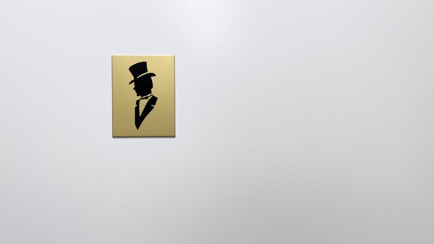 Men's Public Restroom Entrance Sign - White Door with Iconic Gentleman Silhouette Symbol in Top Hat and Tuxedo for Male Bathroom Access and Facilities Royalty-Free Stock Footage #3477577619