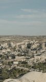 Vertical video. Goreme Panorama, a natural park in the ancient city of Cappadocia, Turkey, viewed from above.