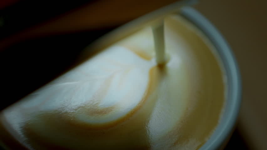 barista make coffee latte art with coffee espresso machine in coffee shop cafe in vintage color tone.