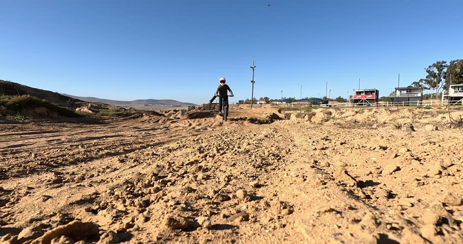 Electric bike, dirt and tyres with sports person off road for competition, performance or race. Motorcycle, training and wheels with athlete rider on course for adventure, adrenaline or power