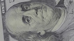 Extreme close-up of Benjamin Franklin's portrait on the US $100 bill. Highlighting the precision of currency engraving and the iconic features of one of America's founding fathers - Powered by Shutterstock - Get 15% off with code: PIKWIZARD15
