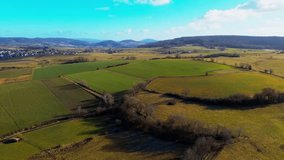 Aerial Panorama of Varied Farmlands Nestled in a Tranquil Valley