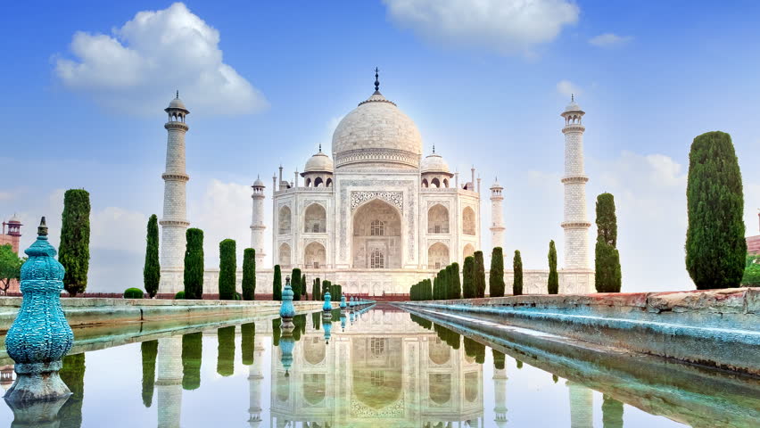 4K time lapse of Taj Mahal, an ivory-white marble mausoleum on the south bank of the Yamuna river in Agra, Uttar Pradesh, India. One of the seven wonders of the world.