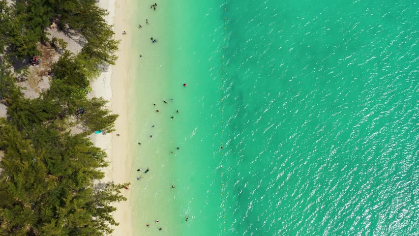 Mauritius beach aerial view of Mont Choisy beach in Grand Baie, Pereybere North. Mont Choisy, public beach in Mauritius island, Africa. Beautiful beach of Mont Choisy in Mauritius, drone aerial view.