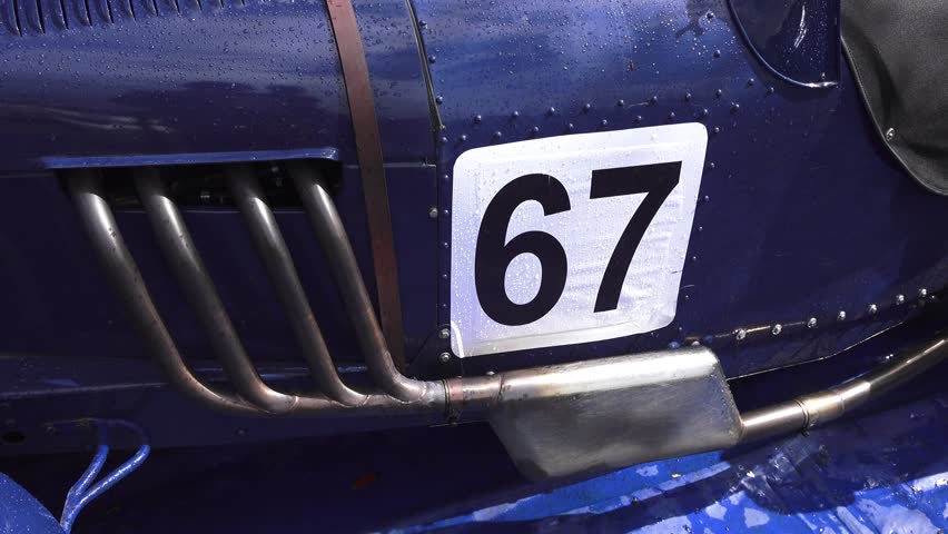 Classic old race car race number and side exhaust system