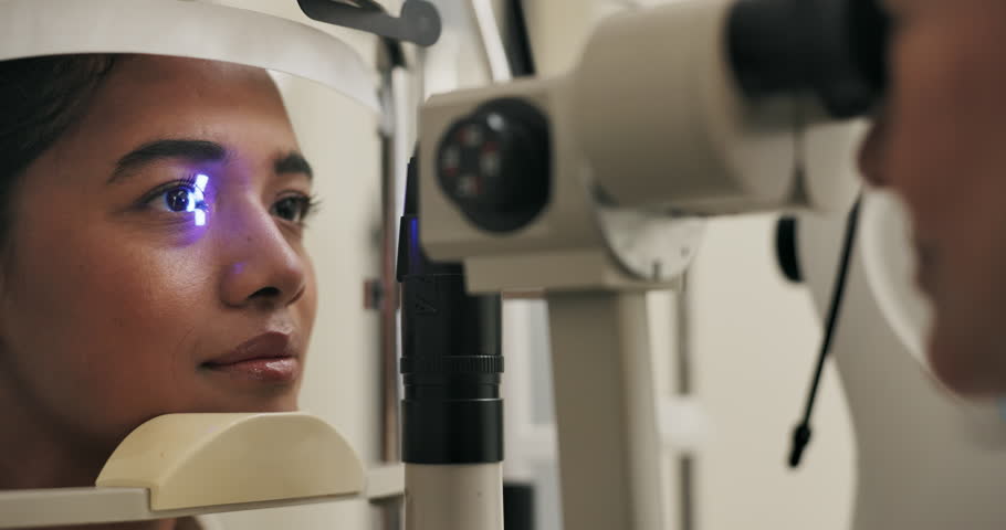 Vision, woman and eye test in office with light, medical practice for optical exam or consultation. Optometry, technology and ocular tonometry machine, female patient at professional ophthalmologist
