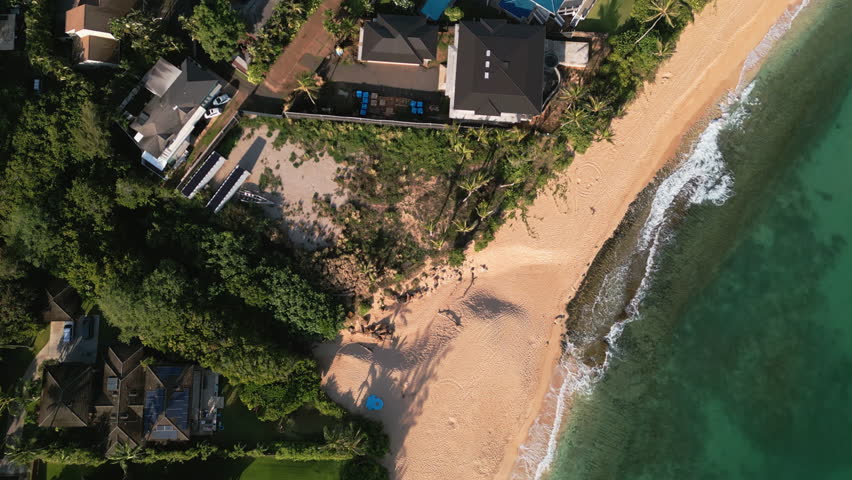 Top aerial view of countryside landscape on Oahu Island. Small town on sunny day in Honolulu, Hawaii. High quality 4k footage