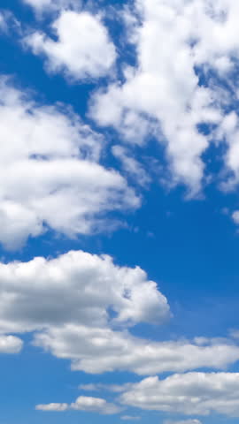 Beautiful transforming cloudscape in the bright blue sky. Fantastic timelapse on summer daytime. Vertical video. Royalty-Free Stock Footage #3478157279