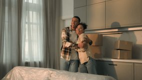 African American family happy affectionate couple home owners renters man woman moving in new apartment relocation buying house joyful male female bonding enjoy renovation real estate mortgage credit - Powered by Shutterstock - Get 15% off with code: PIKWIZARD15