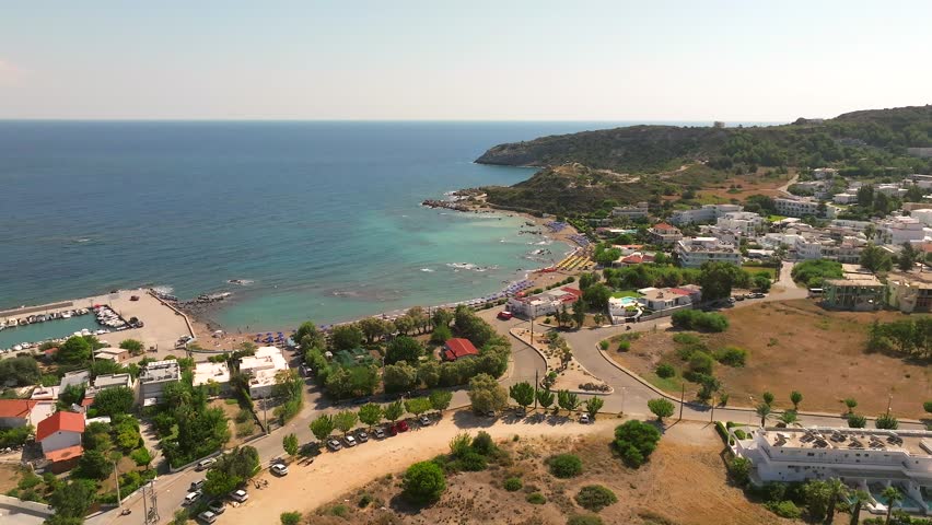 Faliraki bay area and coastline in Rhodes greece on a beautiful day with waterfront resorts and the Mediterranean Sea