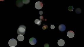 abstract colorful transparent circles appear in the center on a dark background and move to the edges of the screen, change focus, color and disappear. Loop animation