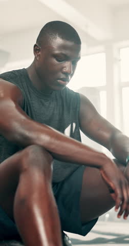 Black man, fitness and break in sweat for workout, exercise or intense training at indoor gym. Portrait of African male person in rest, breathing or recovery after cardio activity, health or wellness