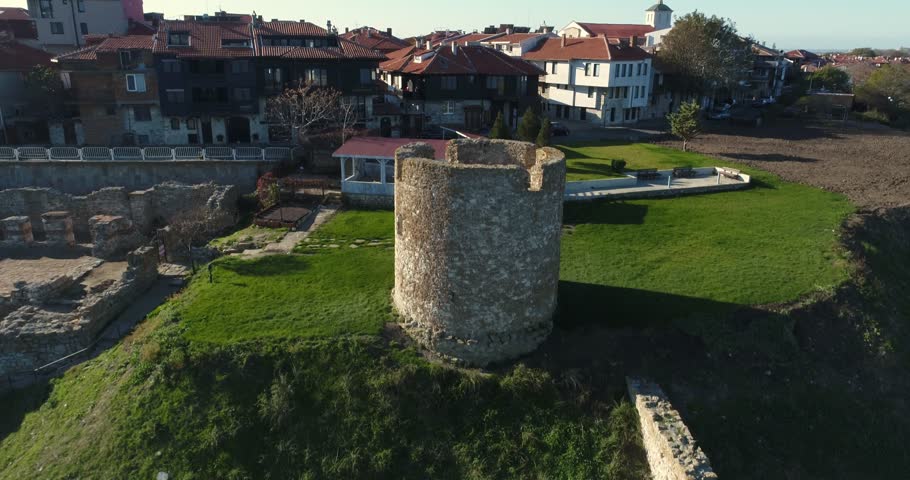 4k aerial video of ruins of ancient watchtower and Nessebar, ancient city on the Black Sea coast of Bulgaria. 