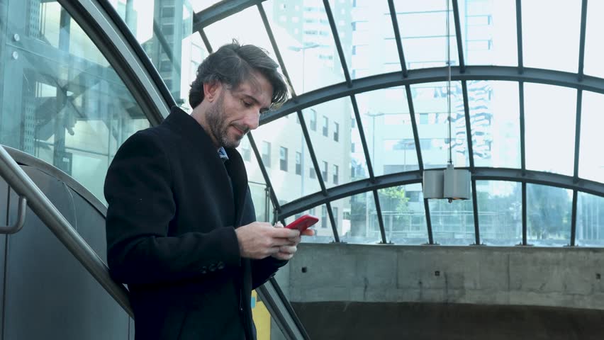 View of one young man with smartphone at daytime with city view landscape in the background. Royalty-Free Stock Footage #3478375573