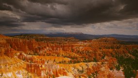 Bryce Canyon with late-afternoon monsoon storms roiling above the canyons famous hoodoos and sandstone spires. - Powered by Shutterstock - Get 15% off with code: PIKWIZARD15