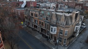 Victorian homes in American city at dusk in autumn. Low aerial shot. - Powered by Shutterstock - Get 15% off with code: PIKWIZARD15