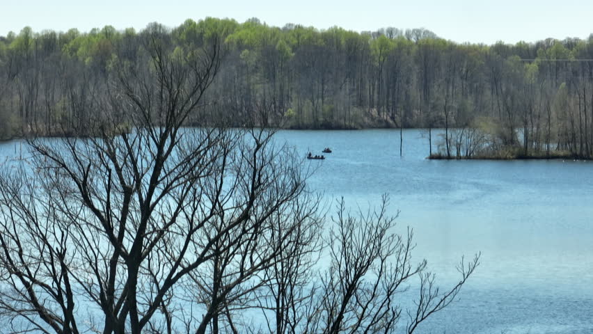 Bare Trees In The Forest By Glenn Springs Lake In Daylight In Tennessee, USA. - aerial shot