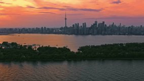 AERIAL Skyline of Toronto, Ontario at sunset