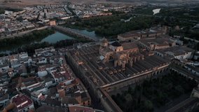 backward aerial view of mosque-cathedral and Guadalquivir River in cordoba,spain