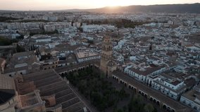 circling aerial view of mosque-cathedral in Cordoba, Spain during blue hour