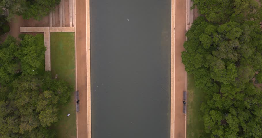 Birds eye view of reflective pond in Hermann Park in Houston, Texas
