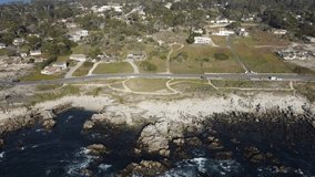 Aerial drone footage zooming out of Asilomar Beach in Monterey