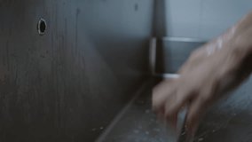 Surgeon doctor washes his hands before surgery in a special modern room with a stainless medical sink in the clinic preparing for surgery - Powered by Shutterstock - Get 15% off with code: PIKWIZARD15