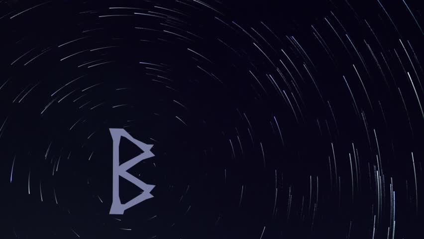 video of a Star trail in the background, with in the foreground the image of a rune moving towards the polar star of the same star trail, the rune in this clip is Berkana