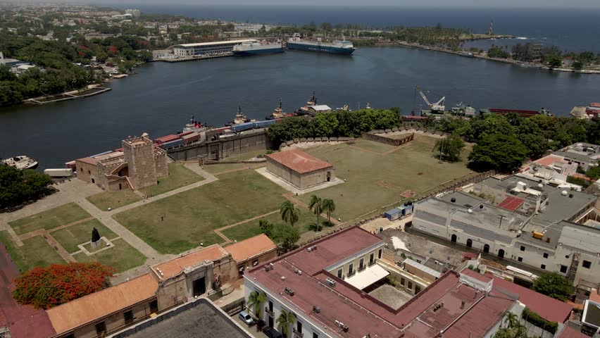 Aerial view of the Ozama fortress and its green areas with the river in the background