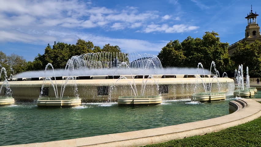 Slow Motion, Magic Fountain, Landmark of Barcelona Spain on Sunny Summer Day