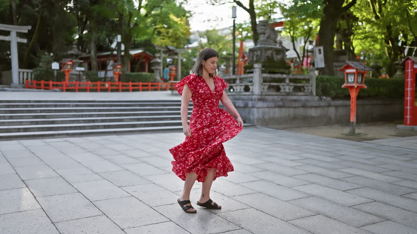 Cheerful beautiful hispanic woman captivatingly spinning around in traditional dress, illuminating the old yasaka temple street, kyoto, with radiance. vacation in japan, freedom embracing dance move. Royalty-Free Stock Footage #3478836469
