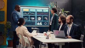 Chief operating officers making a pitch to present project updates and resource allocation in a briefing meeting. Corporate employees review performance metrics and marketing strategies. Camera B. - Powered by Shutterstock - Get 15% off with code: PIKWIZARD15