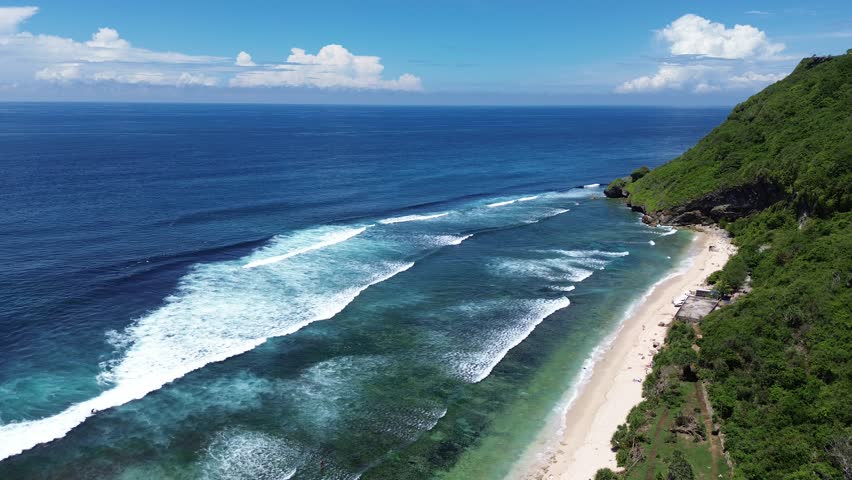 Flying over Nyang Nyang Beach - Bukit Peninsula, Bali, Indonesia Royalty-Free Stock Footage #3478912477