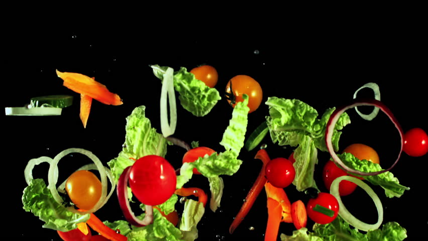 A delicious salad made with fresh natural foods like lettuce, tomatoes, peppers, and onions