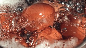 Super slow motion eggs boiled in boiling water. High quality FullHD footage - Powered by Shutterstock - Get 15% off with code: PIKWIZARD15