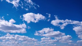 Timelapse of cumulus clouds moves in the blue sky. The background of light and heavy calm clouds changes shape in cloudy space. Natural background, time-lapse, copy space. 4K. - Powered by Shutterstock - Get 15% off with code: PIKWIZARD15
