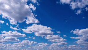 Timelapse of cumulus clouds moves in the blue sky. The background of light and heavy calm clouds changes shape in cloudy space. Natural background, time-lapse, copy space. 4K. - Powered by Shutterstock - Get 15% off with code: PIKWIZARD15